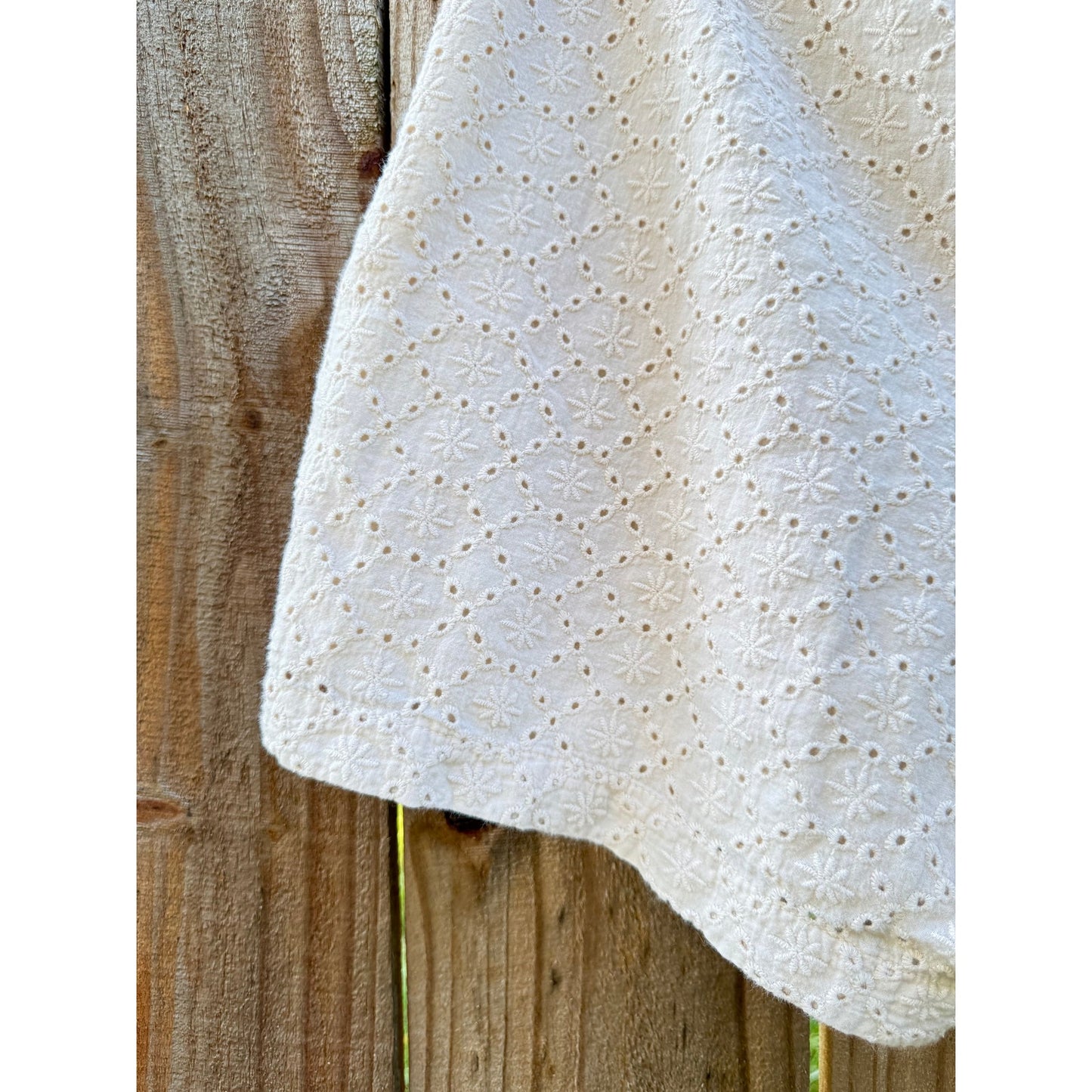 EYELET EMBROIDERED SHORTS — CREAM