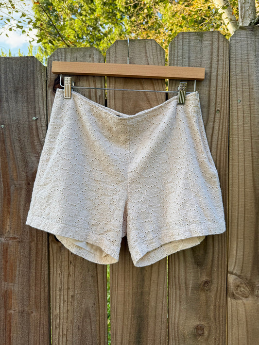 EYELET EMBROIDERED SHORTS — CREAM