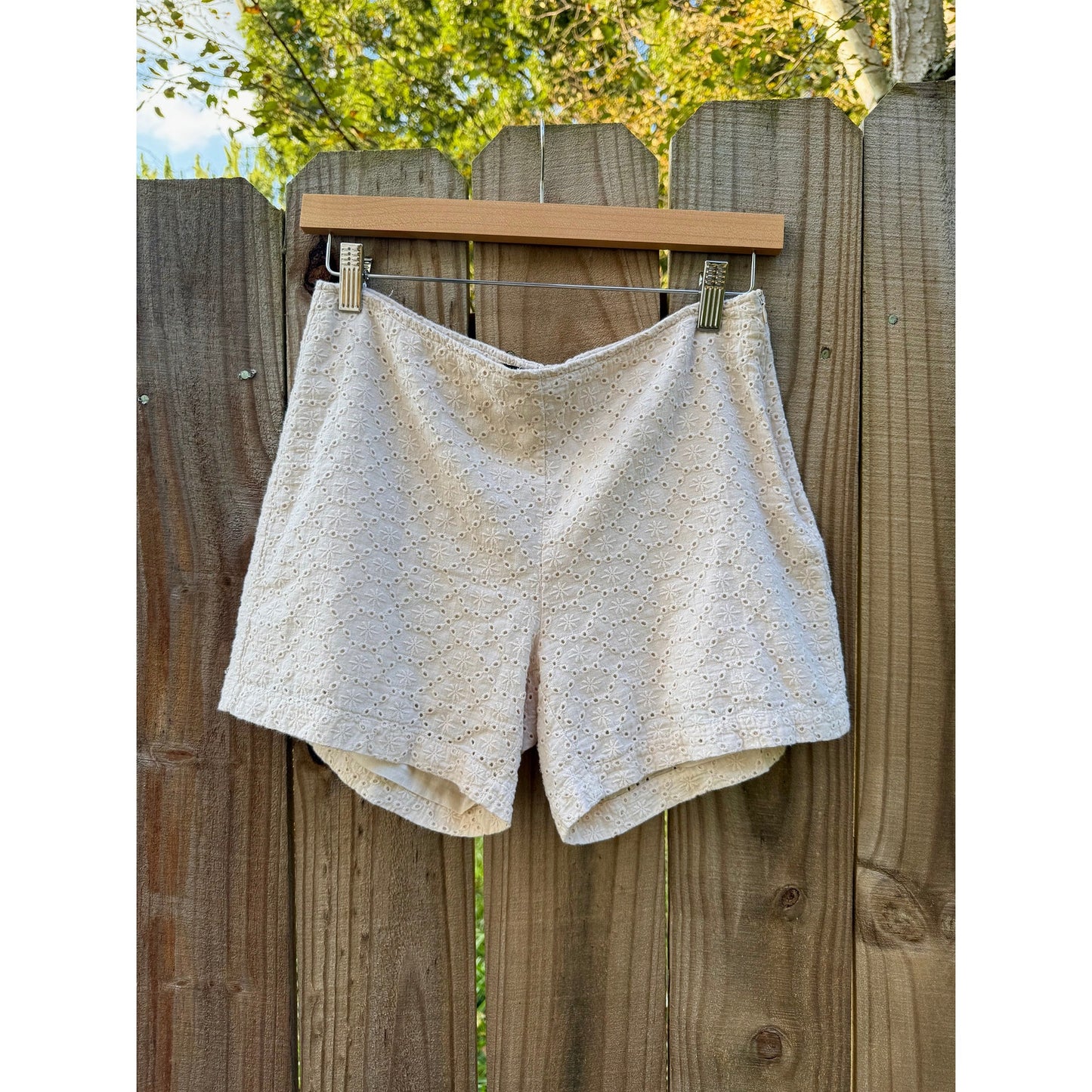 EYELET EMBROIDERED SHORTS — CREAM